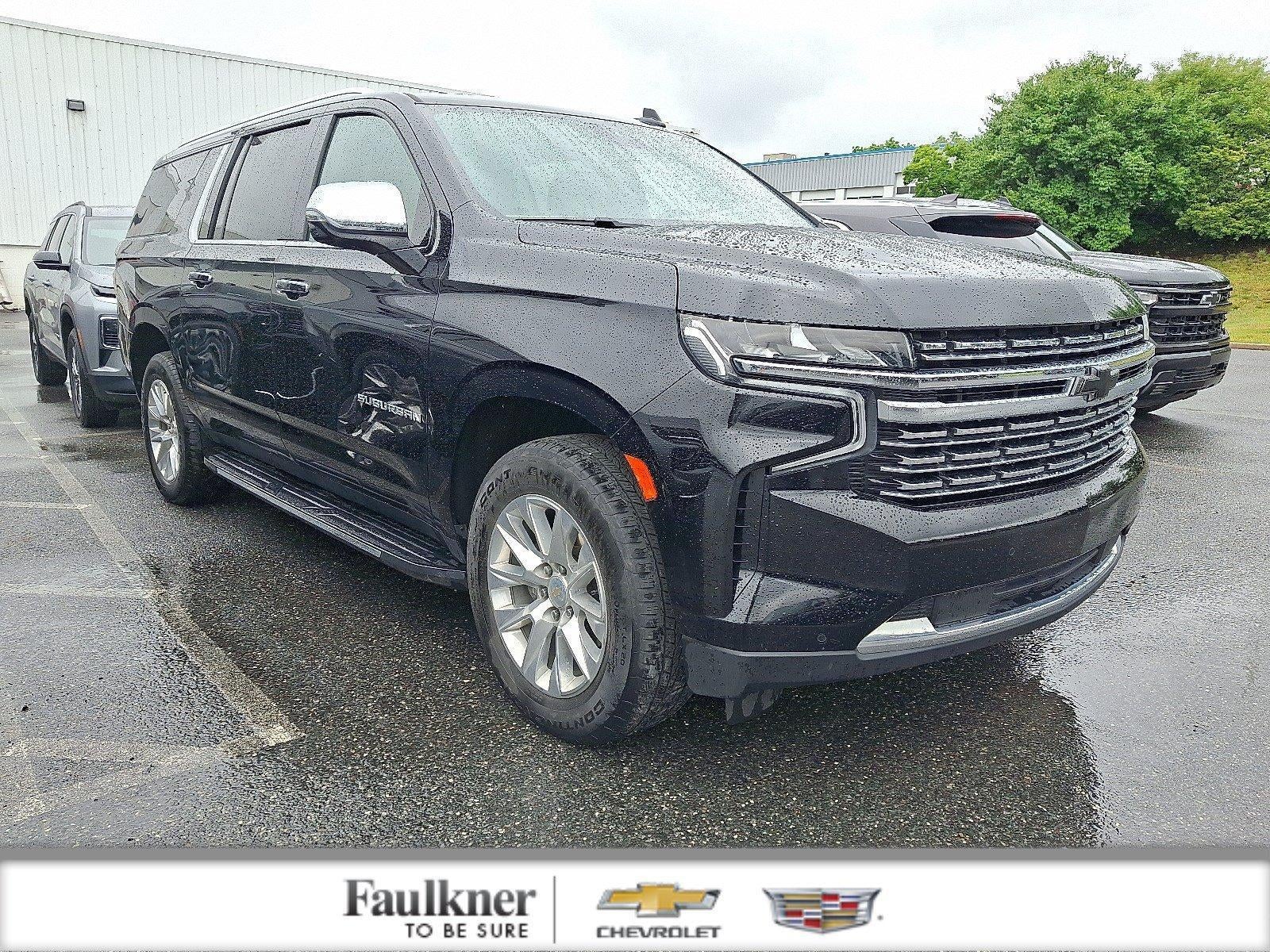 2023 Chevrolet Suburban Premier in Black — front three-quarter view