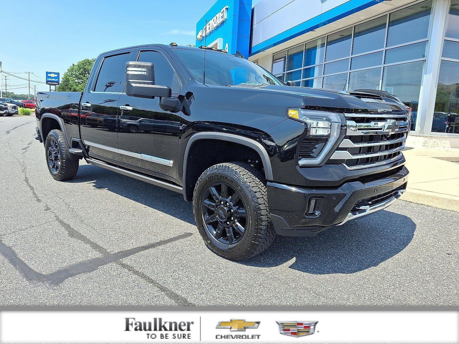 2025 Chevrolet Silverado 2500 HD High Country in Black — front three-quarter view