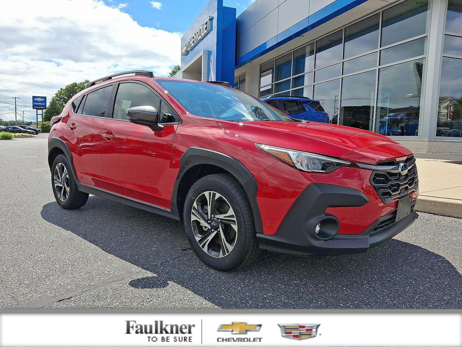 2025 Subaru Crosstrek Premium in Pure Red — front three-quarter view