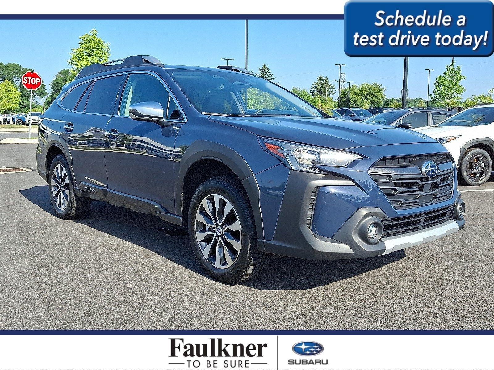 2023 Subaru Outback Touring CVT in Cosmic Blue Pearl — front three-quarter view