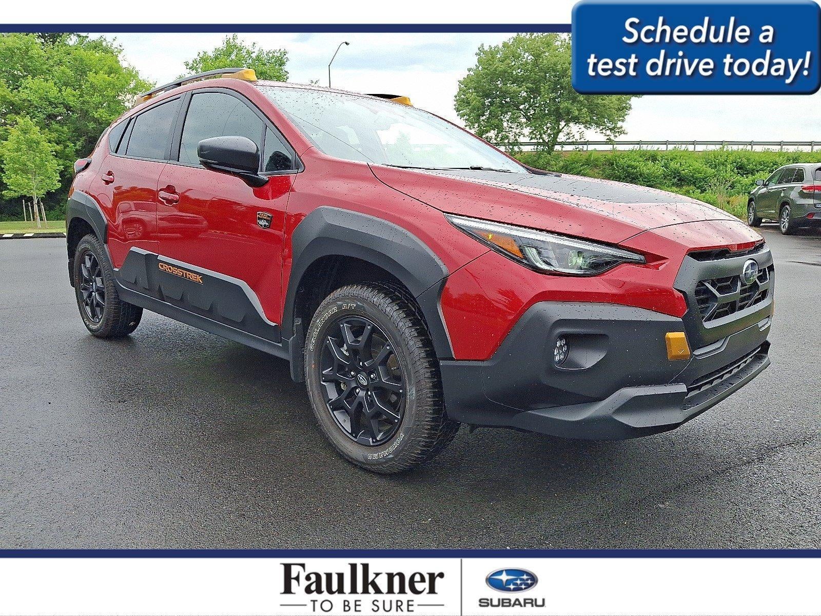 2025 Subaru Crosstrek Wilderness AWD in Lithium Red Pearl — front three-quarter view