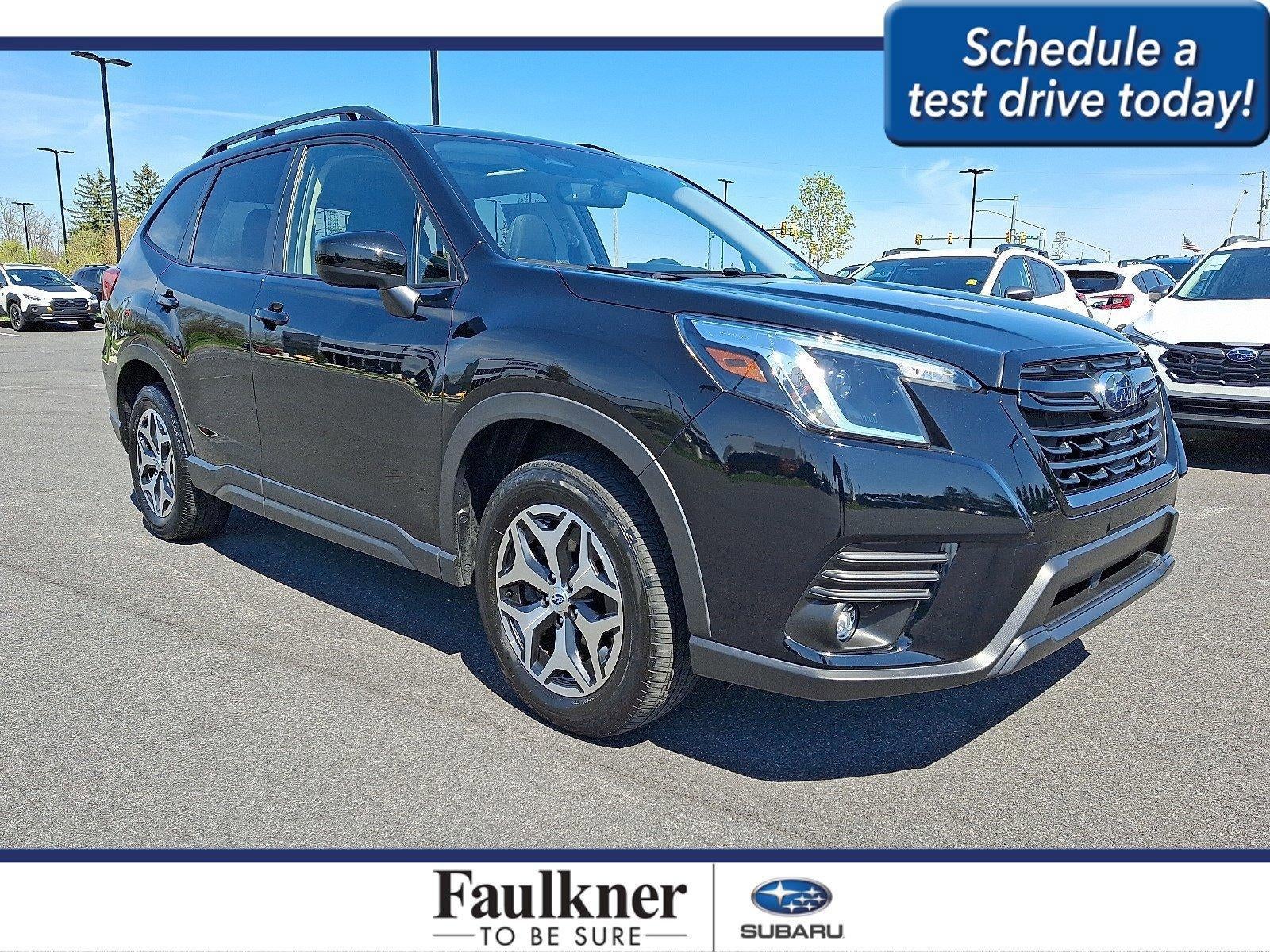 2024 Subaru Forester Premium AWD in Crystal Black Silica — front three-quarter view